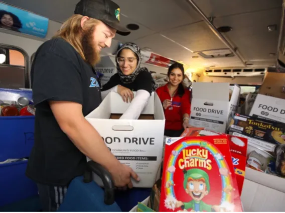 Volunteers organizing and sorting donations inside the Cat Tran