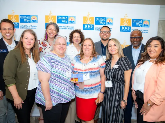 UA Cares Ambassadors and United Way CEO Tony Penn pose for a photo with the Cornerstone Award at the Circle of Excellence Awards hosted by the United Way of Tucson and Southern Arizona.