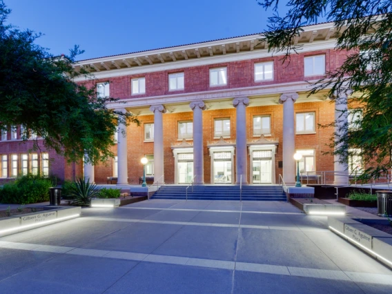 Image of the Forbes building lit from inside during sunset