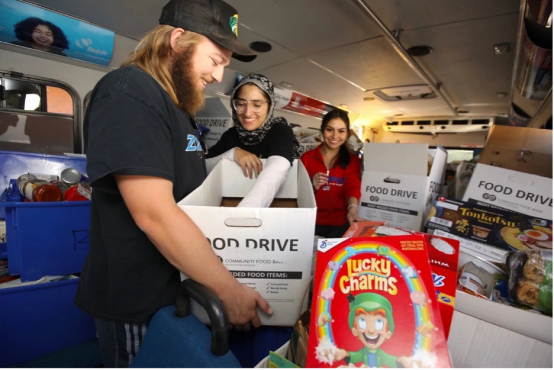 Volunteers organizing and sorting donations inside the Cat Tran