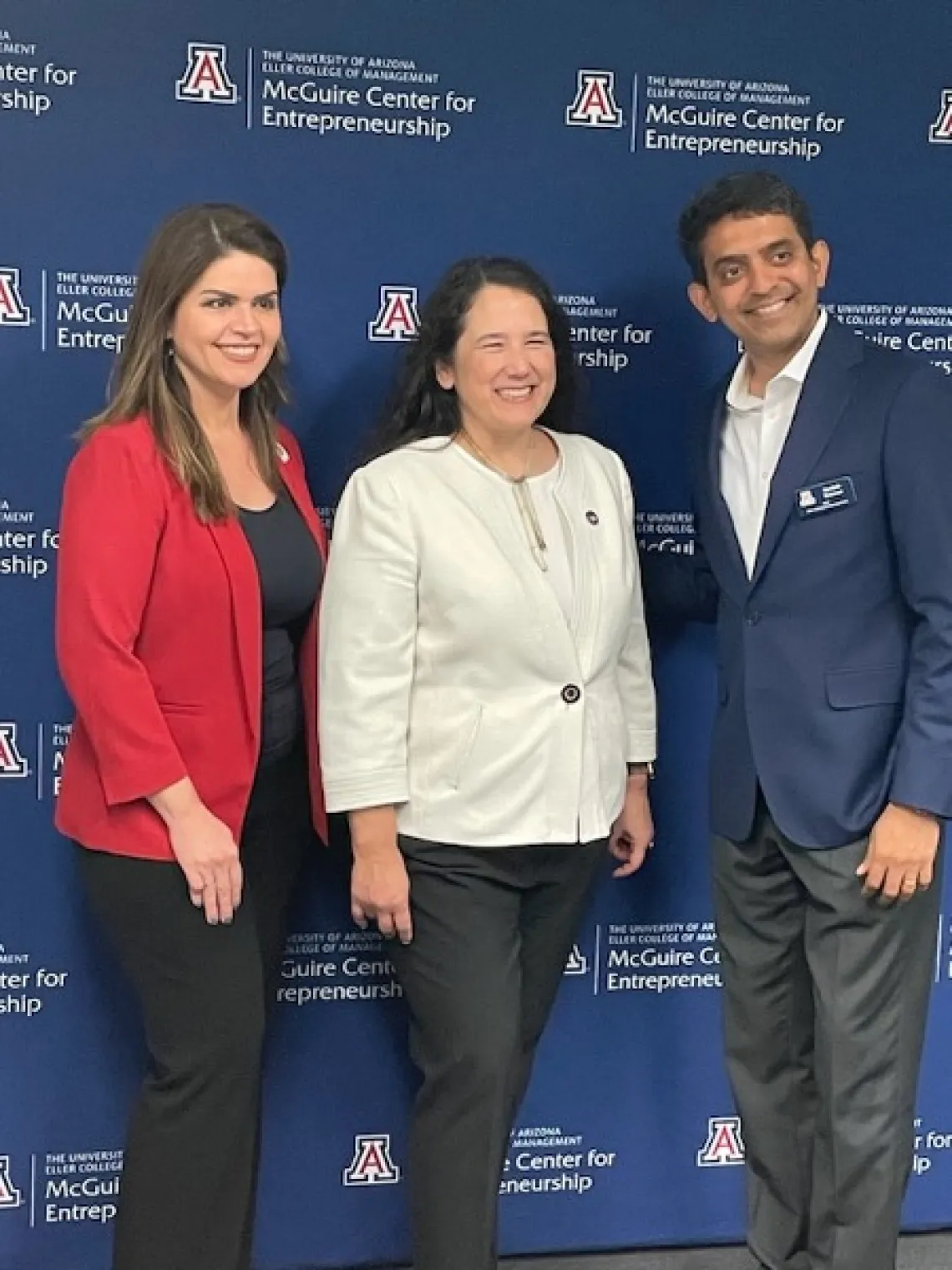 Mayor Romero, Small Business Administration Administrator Isabella Casillas Guzman, and Eller Dean Kannan pose for a photo