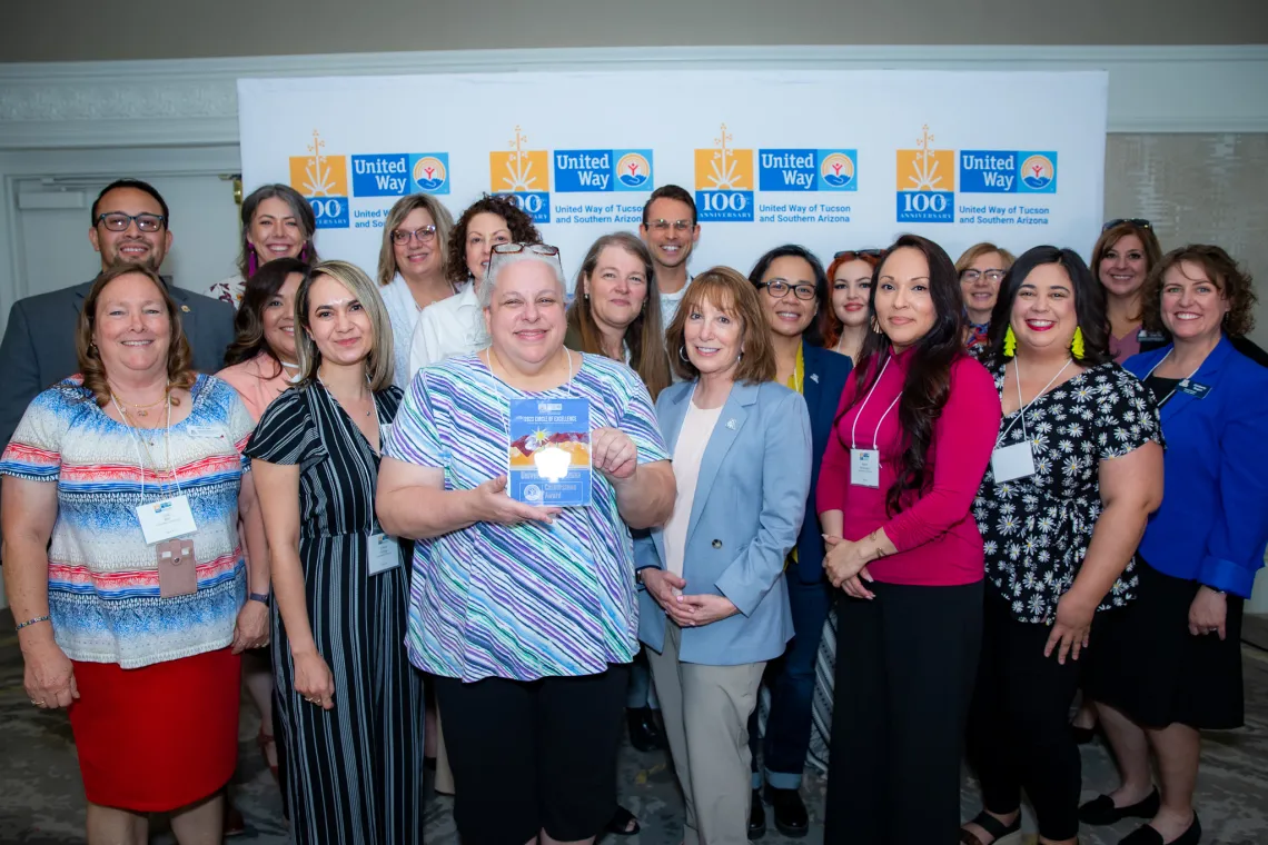 UA Cares Ambassadors and campus supporters pose for a photo with the Cornerstone Award at the Circle of Excellence Awards hosted by the United Way of Tucson and Southern Arizona.