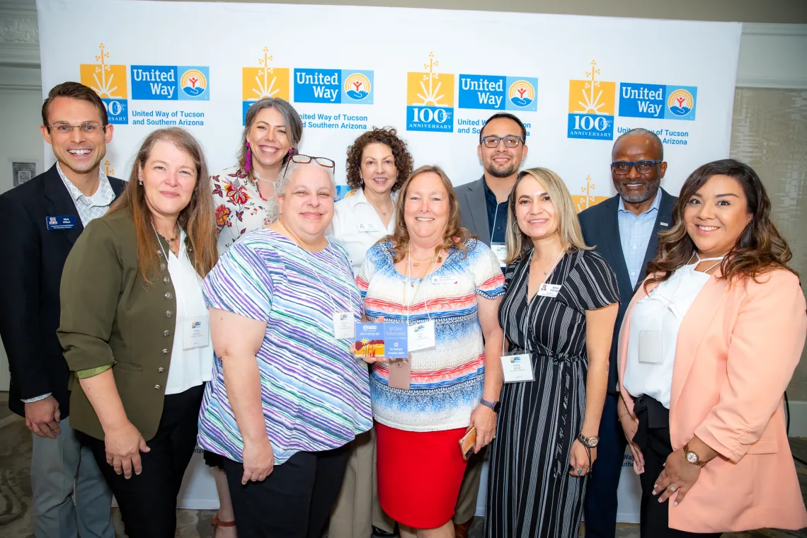 UA Cares Ambassadors and United Way CEO Tony Penn pose for a photo with the Cornerstone Award at the Circle of Excellence Awards hosted by the United Way of Tucson and Southern Arizona.