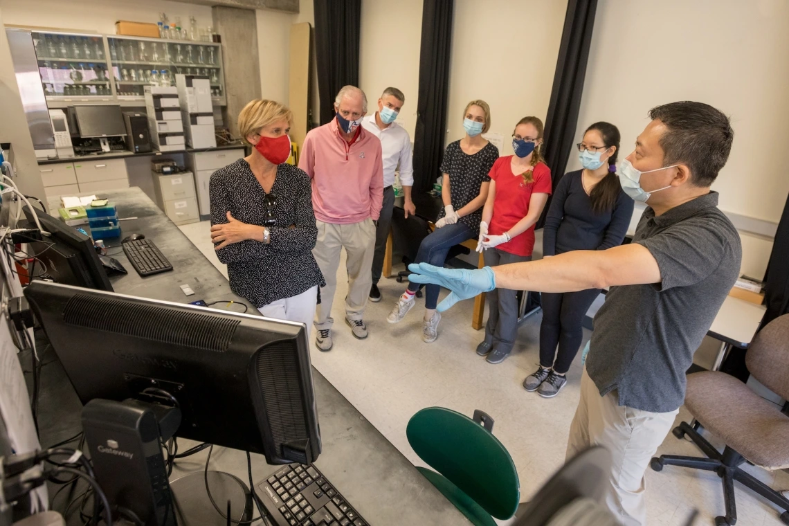 Biomedical engineering professor Jeong-Yeol Yoon and his team show President Robert C. Robbins and Provost Liesl Folks around the Biosensors Lab.