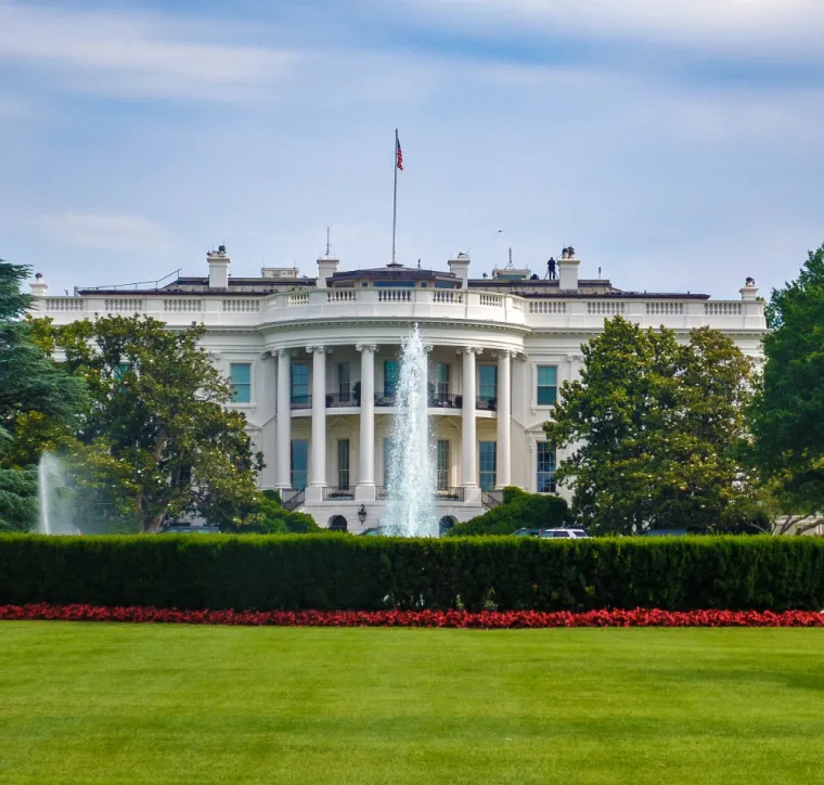 U.S. White House, fountain, and lawn as seen from a distance