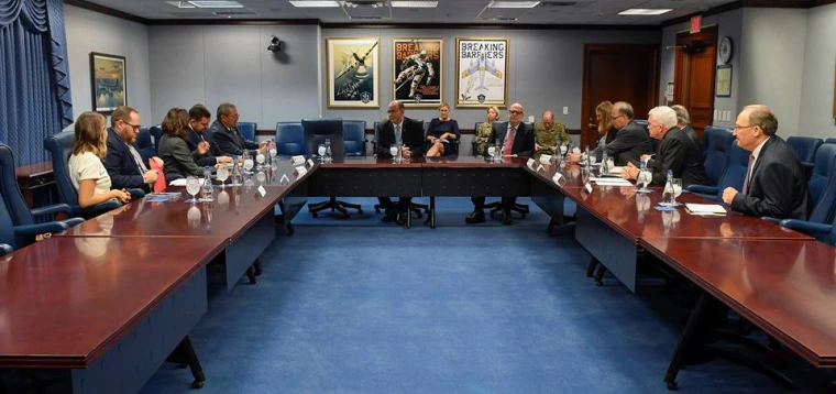 Southern Arizona community leaders sit in a conference room speaking with Arizona's Congressional Delegation