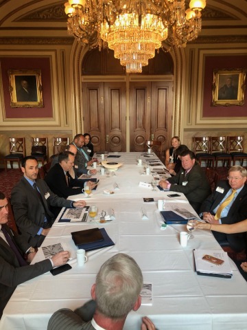 A group of Arizona state lawmakers sit at a table as they meet with Arizona's federal delegates in D.C.