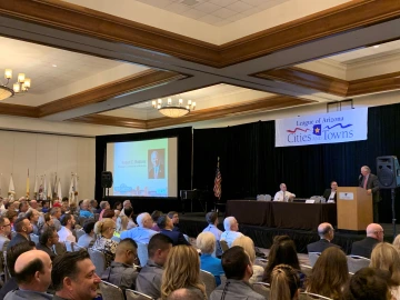 President Robbins addresses an audience at the Arizona League of Cities and Towns Conference