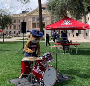 Wilbur plays the drums in front of the Arizona Capitol