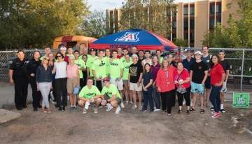 Students and staff posing for a photo at the first annual Wildcat Welcome Walk