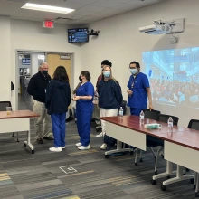 Pres. Robbins and students at Michael E. DeBakey High School for Health Professionals in Houston